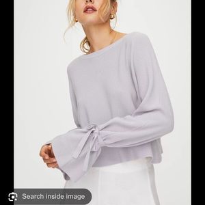 cardigan w/ bows on the arms. can by styled different ways